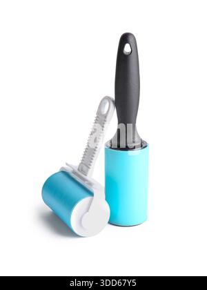 Different lint rollers on white background Stock Photo