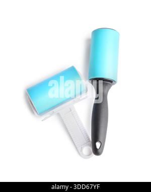 Different lint rollers on white background Stock Photo