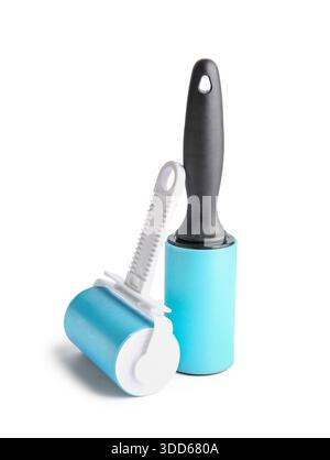 Different lint rollers on white background Stock Photo