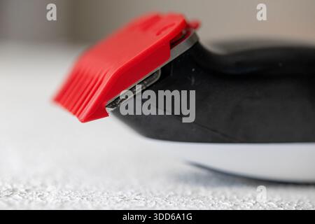 Close-up of a professional electric hair clipper blade in a modern barbershop Stock Photo