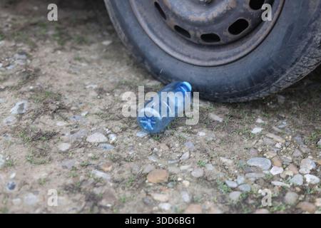 Empty plastic bottle flagon thrown into nature Stock Photo