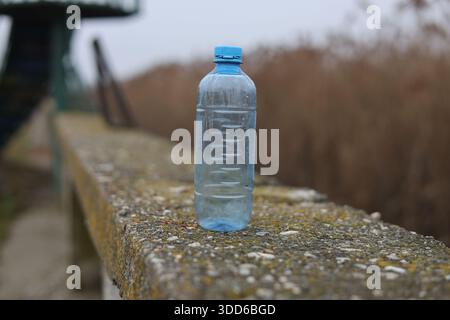 Empty plastic bottle flagon thrown into nature Stock Photo