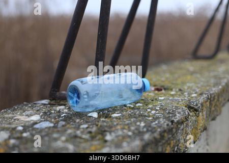 Empty plastic bottle flagon thrown into nature Stock Photo