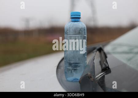 Empty plastic bottle flagon thrown into nature Stock Photo