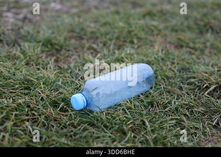 Empty plastic bottle flagon thrown into nature Stock Photo