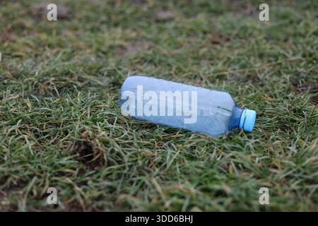 Empty plastic bottle flagon thrown into nature Stock Photo