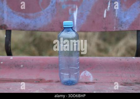 Empty plastic bottle flagon thrown into nature Stock Photo