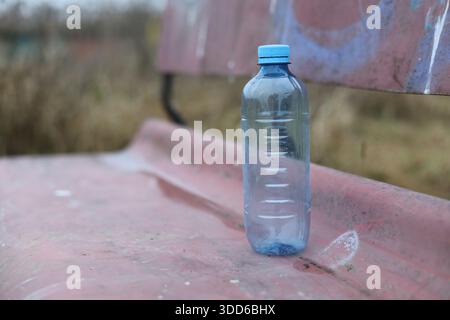 Empty plastic bottle flagon thrown into nature Stock Photo