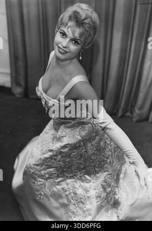 October 10, 1956, London, United Kingdom: BRIGITTE BARDOT at the savoy  Hotel wearing a 1,000 GB Pound white satin dress for a Royal Film  performance later that evening. (Credit Image:  Keystone