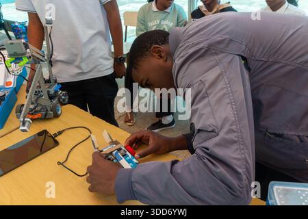 Students assemble and test an educational robot using electronic parts Stock Photo