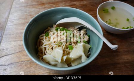 Noodles with minced chicken and dumplings Stock Photo