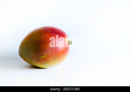 Mango, fruit also called the "king of tropical fruits" isolated on white background. Tropical fruit native to India. Healthy and delicious food. Stock Photo
