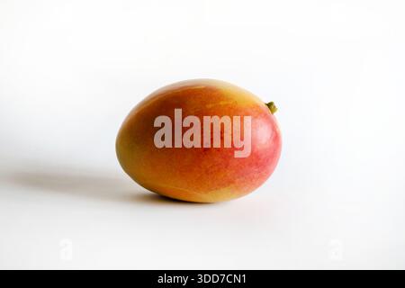 Mango, fruit also called the "king of tropical fruits" isolated on white background. Tropical fruit native to India. Healthy and delicious food. Stock Photo