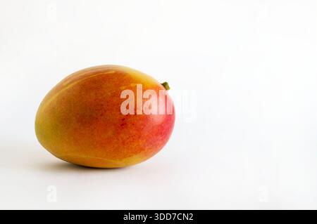 Mango, fruit also called the "king of tropical fruits" isolated on white background. Tropical fruit native to India. Healthy and delicious food. Stock Photo