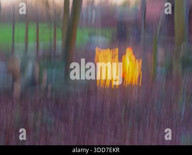 A roadside Christmas lights display taken using intentional camera movement . Norfolk, UK Stock Photo