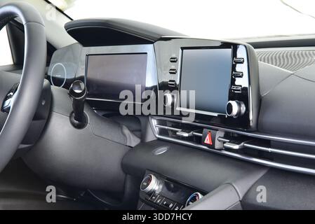 Screen multimedia system on dashboard in a modern car Stock Photo