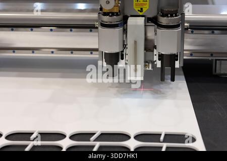Oscillating knife digital cutting machine close up. Selective focus. Stock Photo