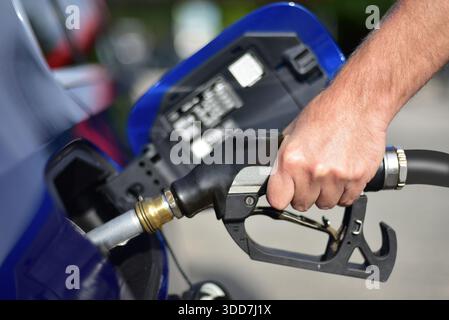 Filling a car with fuel at a gas station Stock Photo