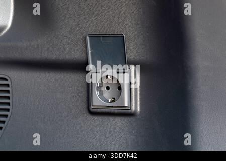 220 volt socket in the trunk of the car Stock Photo