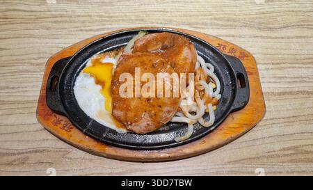 Taiwan Hot Plate Pork with Egg and Noodles Restaurant Dish Close Up Stock Photo