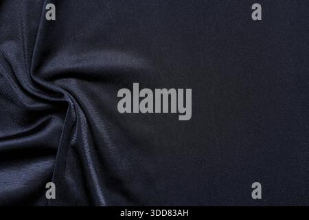 Dark navy fabric texture with smooth folds, soft textile weave and elegant minimal surface for luxury backgrounds. Copy space Stock Photo
