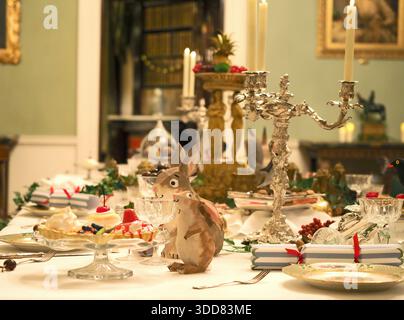 Dining table set for Christmas, with model animals, Ickworth, Suffolk, UK Stock Photo