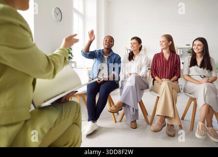 Female Business Team Asking Questions During Meeting In Office Stock Photo
