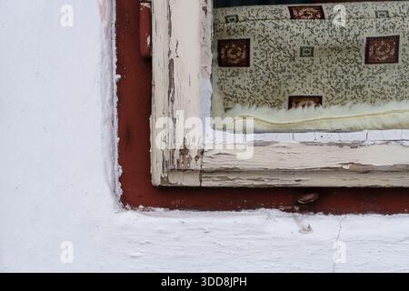 Close-up of White Wall Window with Red Frame and Curtain Stock Photo