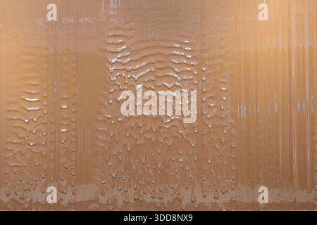 Melted chocolate dripping. Rich, indulgent dessert background suitable for cafes, bakeries, or party setups. Stock Photo