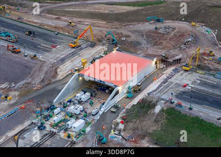 Fareham, Hampshire, UK.  29th December 2025.  Aerial view of the M27 at Junction 10 near Fareham in Hampshire where a new underpass is being constructed.  The M27 is closed for eleven days over Christmas and New Year to allow for the construction.  The motorway is shut in both directions between Junction 9 at Whiteley and Junction 11 at Fareham.  Engineers have excavated the embankment and slid in an 8,500-tonne pre-built concrete structure—known as a “box slide”—into the embankment. The motorway is scheduled to reopen on 4th January 2026.  Picture Credit: Graham Hunt/Ģ����ý Live News Stock Photo