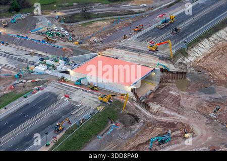 Fareham, Hampshire, UK.  29th December 2025.  Aerial view of the M27 at Junction 10 near Fareham in Hampshire where a new underpass is being constructed.  The M27 is closed for eleven days over Christmas and New Year to allow for the construction.  The motorway is shut in both directions between Junction 9 at Whiteley and Junction 11 at Fareham.  Engineers have excavated the embankment and slid in an 8,500-tonne pre-built concrete structure—known as a “box slide”—into the embankment. The motorway is scheduled to reopen on 4th January 2026.  Picture Credit: Graham Hunt/Ģ����ý Live News Stock Photo