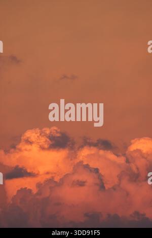 Dramatic red evening sky with low-level deep red stratocumulus cloud formation and sky. Stock Photo