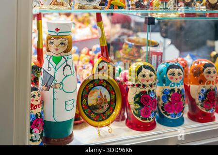 Moscow, Russia, 29 December 2025, Traditional Russian nesting dolls (Matryoshka) on a shelf, featuring a unique doll painted as a doctor or nurse with Stock Photo