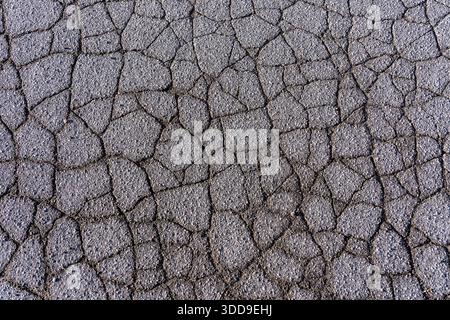 Asphalt surface, ground, with many small cracks, road, car park, Stock Photo
