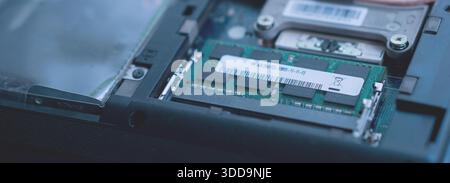 High-tech visualization of computer hardware with a focus on the RAM module, featuring a cool blue cinematic tone to emphasize modern technology and d Stock Photo