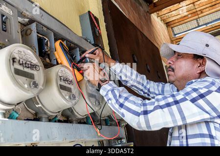 Puebla Mexico,San Andres Cholula,adult man male,Hispanic Latino Mexican,electric utility worker,technician electrician,working job,checking electricit Stock Photo
