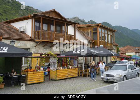 Cosy marketplace with cafes and shops framed by mountains under a cloudy sky, houses on Mtskheta Square, Mtskheta, Mtskheta, Mtskheta, Mtskheta-Mtiane Stock Photo