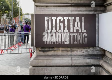 Digital Marketing Concept Shown On City Street Sign With Pedestrians And Urban Background Stock Photo