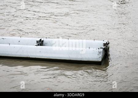 Floating River Barrier Concept Shown As Modular Water Control Structure On Flowing River Surface Stock Photo