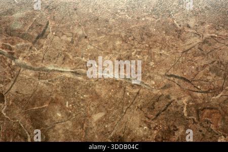 Brown agate, a close-up pattern with inclusions and stripes of polished natural stone. Background, seamless, texture. Stock Photo