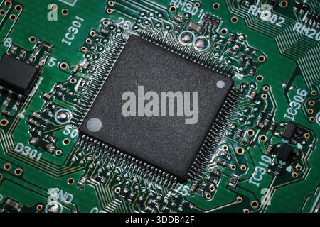 Semiconductor on a circuit board. Macro shot of a chip integrated in a modern electronic device Stock Photo