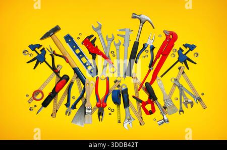 A set of many tools on eye-catching yellow background. Suitable to represent work, craftsmanship, handcraft, carpentry or home improvement. Stock Photo