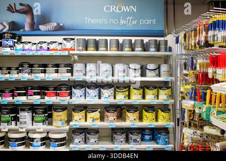 Sliema, Malta - December 24, 2025: Crown Trade And Crafted Paint Cans On Shelves With Brushes And Rollers In A Home Improvement Store. Stock Photo