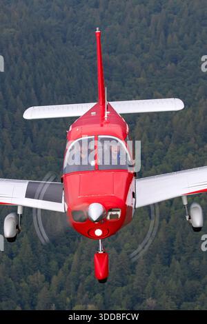 A Piper PA-28-140 Cherokee, registered as C-FXKP with serial number 28-22195, is shown from a close-up pilot view at the Abbotsford International Airshow in Canada in 2031. This single-engine, low-wing aircraft accommodates four passengers and features fixed tricycle landing gear. The image highlights the cockpit, controls, and pilot operations. The aircraft is presented in a public aviation display, demonstrating the handling, design, and functional features typical of the Piper Cherokee series. Stock Photo
