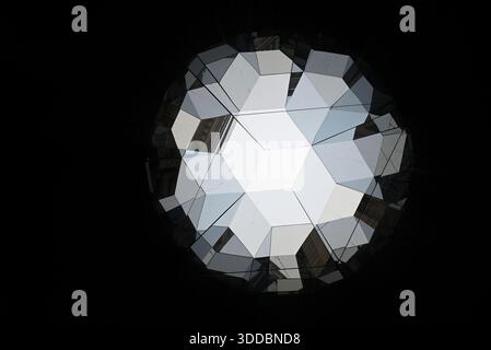 Kaleidoscopic view of the Hamburg town hall. Black and blue colors. Look from buttom. Mirroring and squares. Stock Photo