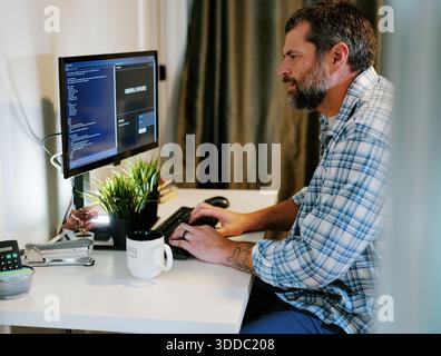 Middle Aged Software Engineer Vibe Codes Landing Page for Artificial Intelligence Based Integrated Development Environment Application Concept Stock Photo