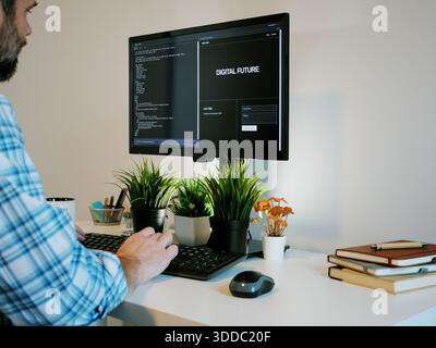Middle Aged Software Engineer Vibe Codes Landing Page for Artificial Intelligence Based Integrated Development Environment Application Concept Stock Photo