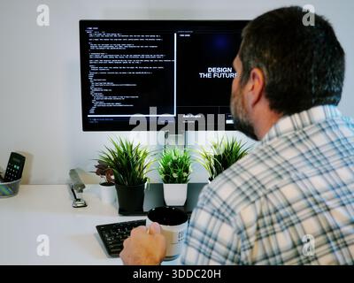 Middle Aged Software Engineer Vibe Codes Landing Page for Artificial Intelligence Based Integrated Development Environment Application Concept Stock Photo