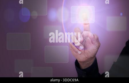 Technology theme hologram with man working on computer on background. High tech concept. Man touching digital virtual buttons on hologram screen with Stock Photo