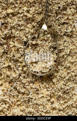 Top View of Chopped Walnut Kernels In Spoon, Macro, Superfood For Baking And Cooking. Stock Photo